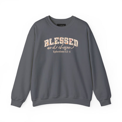 On the front of this custom Christian sweatshirt is the bible verse Blessed and Chosen Ephesians 1:3-4 with the word Blessed being in large bubble letters with a floral pattern on the inside of the letters.