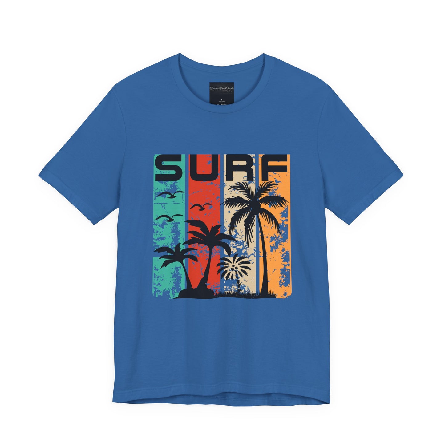 On the front of this custom vacation shirt is the word SURF in large letters at the top of the shirt, each letter has a different colored line through it to the bottom, there are images of palm trees and birds flying underneath the word.