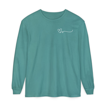 On the top right chest of this custom long sleeve t-shirt is a heart with a trail behind it signifying a heartbeat that you would see on a heart monitor. Perfect for health care workers and teachers.