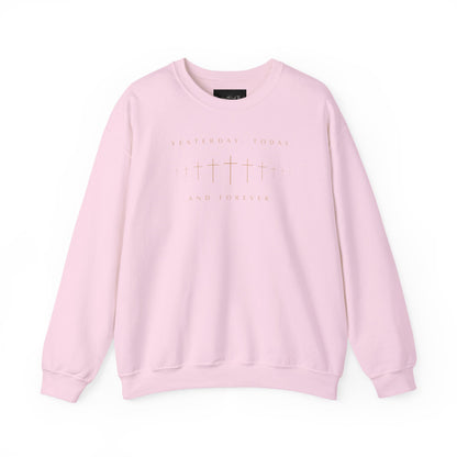 On the front of this Christian pullover sweatshirt is a row of Jesus crosses that look like they are fading into the distance, the words Yesterday, Today and Forever are on the top and the bottom of the crosses.
