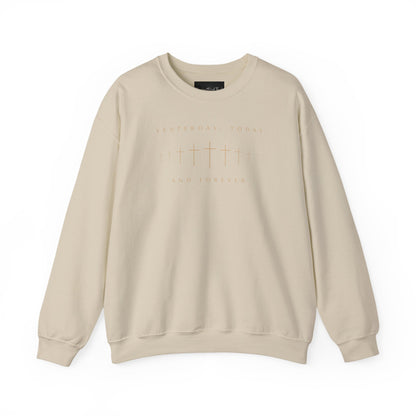 On the front of this Christian pullover sweatshirt is a row of Jesus crosses that look like they are fading into the distance, the words Yesterday, Today and Forever are on the top and the bottom of the crosses.
