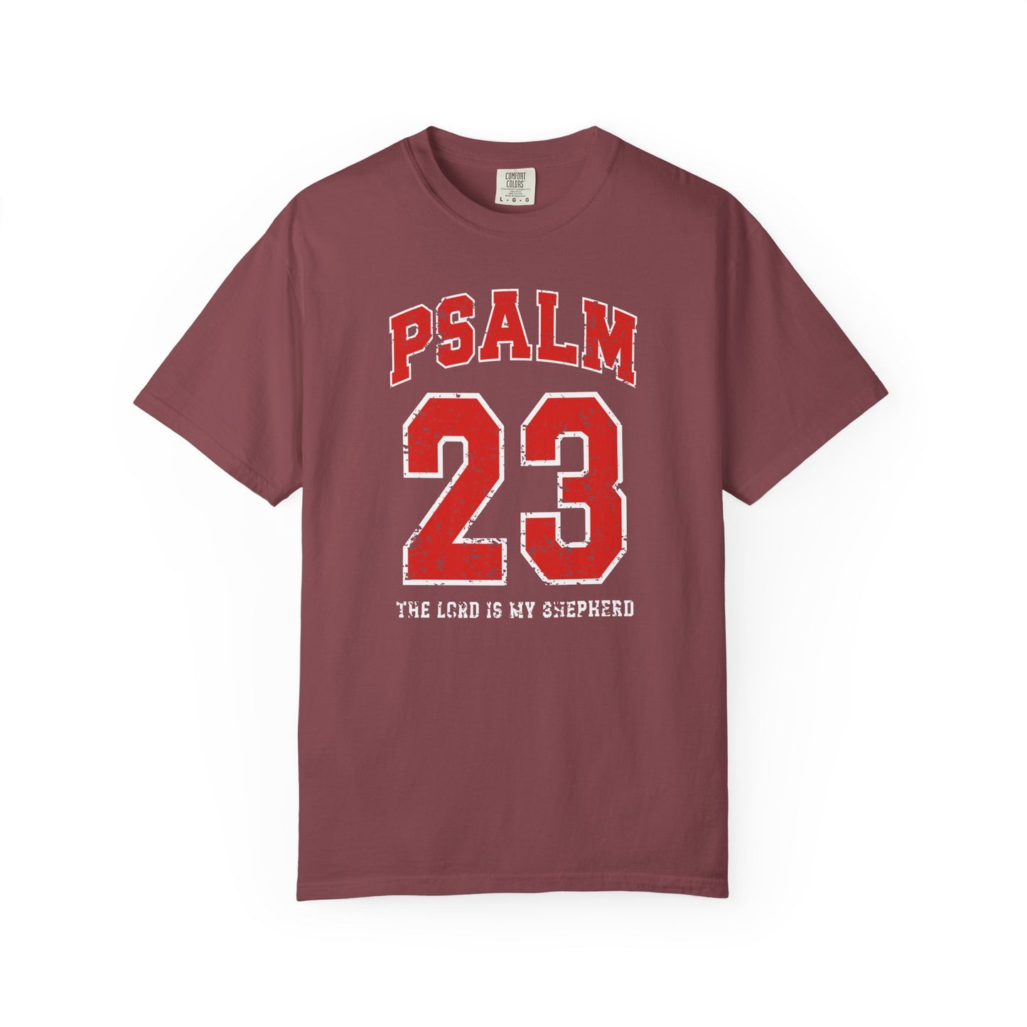 On the front side of this custom vintage t-shirt are the words Psalm 23 The Lord Is My Shepherd, it is with red and white block lettering.