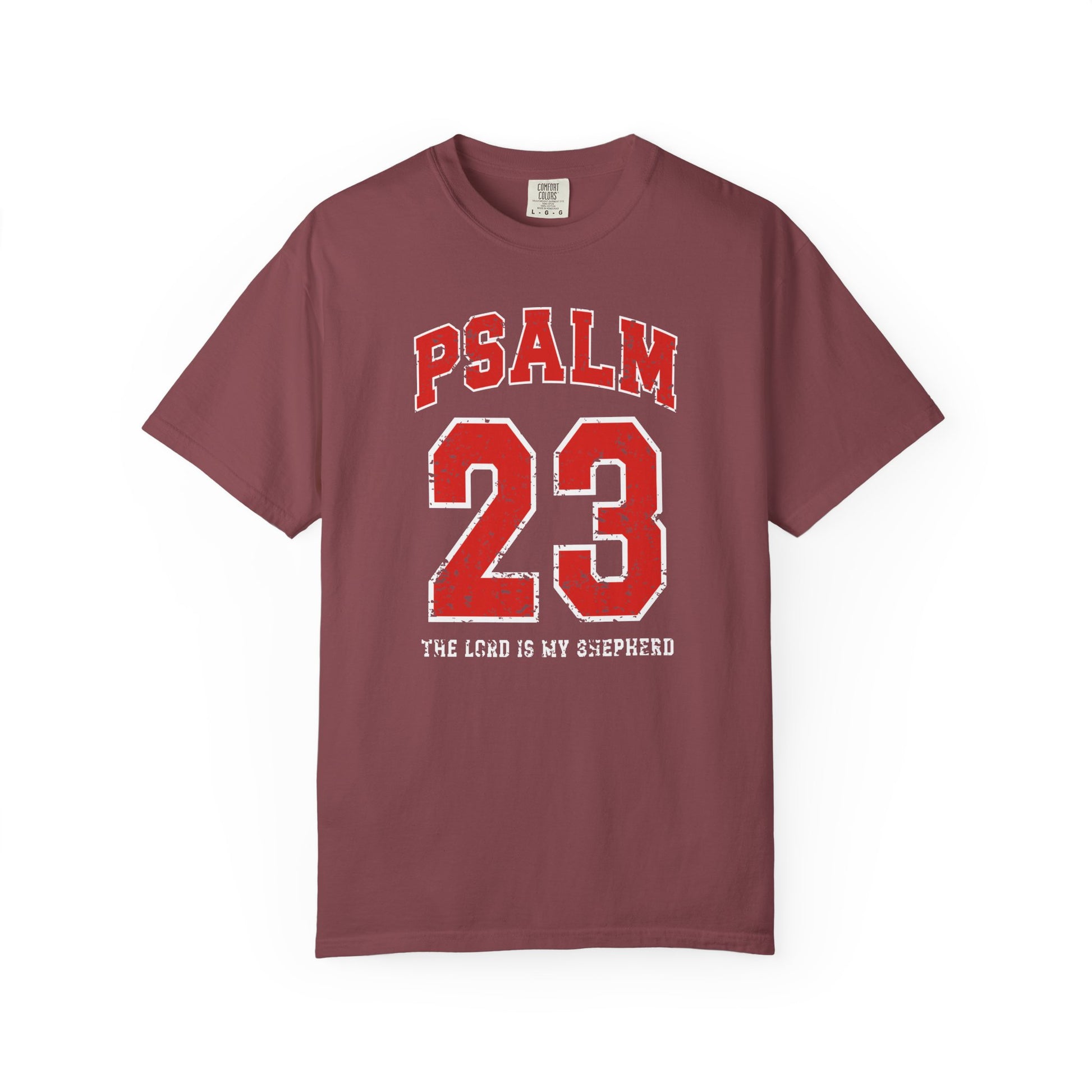 On the front side of this custom vintage t-shirt are the words Psalm 23 The Lord Is My Shepherd, it is with red and white block lettering.