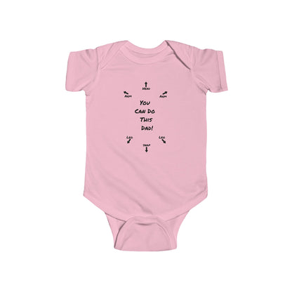 on the front of this custom infant onesie specifically meant for dads, are the words You can do this dad with arrows pointing where each leg and each arm goes along with were the babies head goes and where to close the snaps, a perfect diagram for a new father on how to put a onesie on a baby.