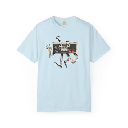 On the front of this custom vintage gaming short sleeve shirt is an image of a old school Nintendo controller, the controller has arms and legs and a face that makes it look like a cartoon character.