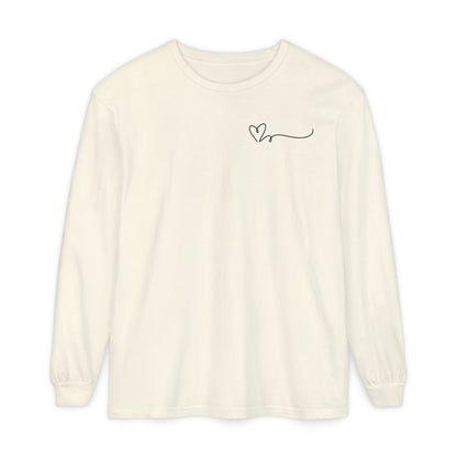 On the top right chest of this custom long sleeve t-shirt is a heart with a trail behind it signifying a heartbeat that you would see on a heart monitor. Perfect for health care workers and teachers.