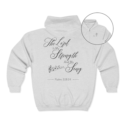 On the front of this custom Christian zip up sweater is a Jesus cross with music notes on the right chest, on the back of the sweater is the scripture the Lord is my strength and my song Psalms 118:14 with music notes underneath the writing.