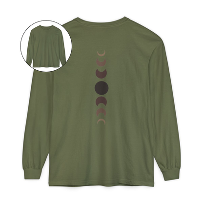 On the back of this custom unisex long sleeve t-shirt from the top of the shirt to the bottom are 7 images of the moon showing the moons cycle, every moon is a different shade of brown.