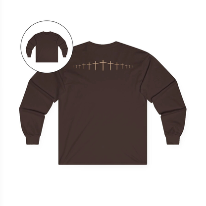 On the back of this brown colored Christian long sleeve shirt is a large wooden Jesus cross in between the shoulder blades, the Jesus cross then keeps getting smaller and smaller till it fades right off the shirt giving it a amazing 3D look on the back.