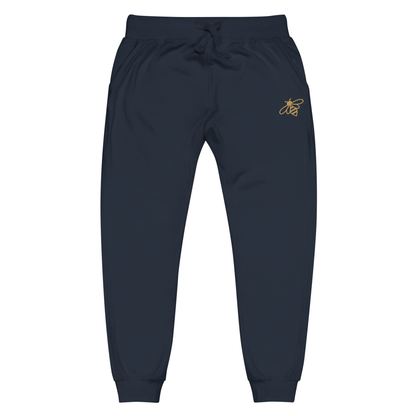 A pair of super soft fleece unisex sweatpants with a bumble bee embroidered in gold over the left front pocket of the pants.