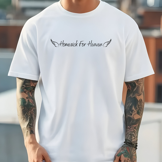 On the front of this custom vintage Christian short sleeve shirt are the words Homesick for Heaven with Angel wings on either side of the writing.