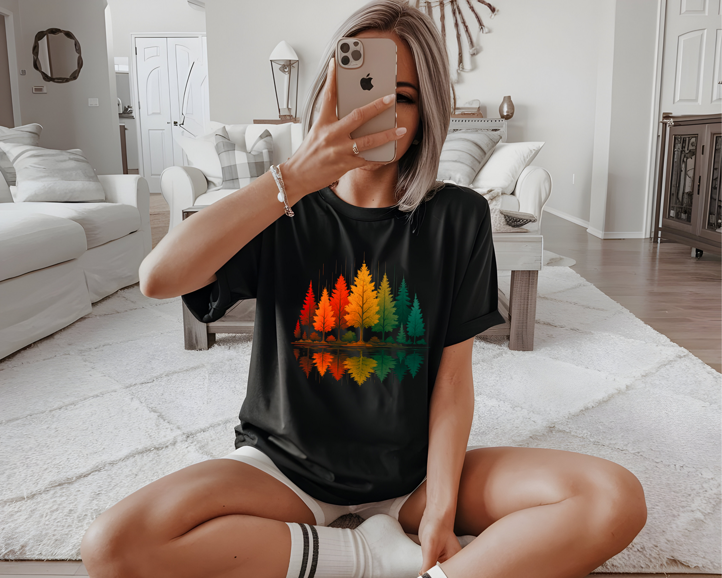 On the front of this custom comfort colors short sleeve shirt is a image of trees in the fall time with all the different fall colors, the trees reflection is right underneath making them look like they are above water.