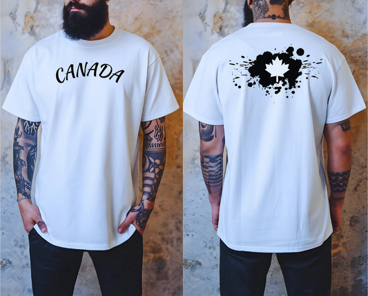 On the front of this custom short sleeve shirt is the word Canada in large letters across the chest, on the back of the shirt in between the shoulder blades is a large paint splatter with a maple leaf in the middle.