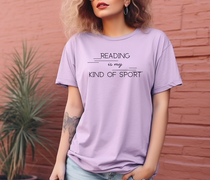 On the front of this custom booklover short sleeve shirt are the words Reading is my Kind of Sport, in a modern font with different length lines on either end of the writing giving the shirt a retro look.