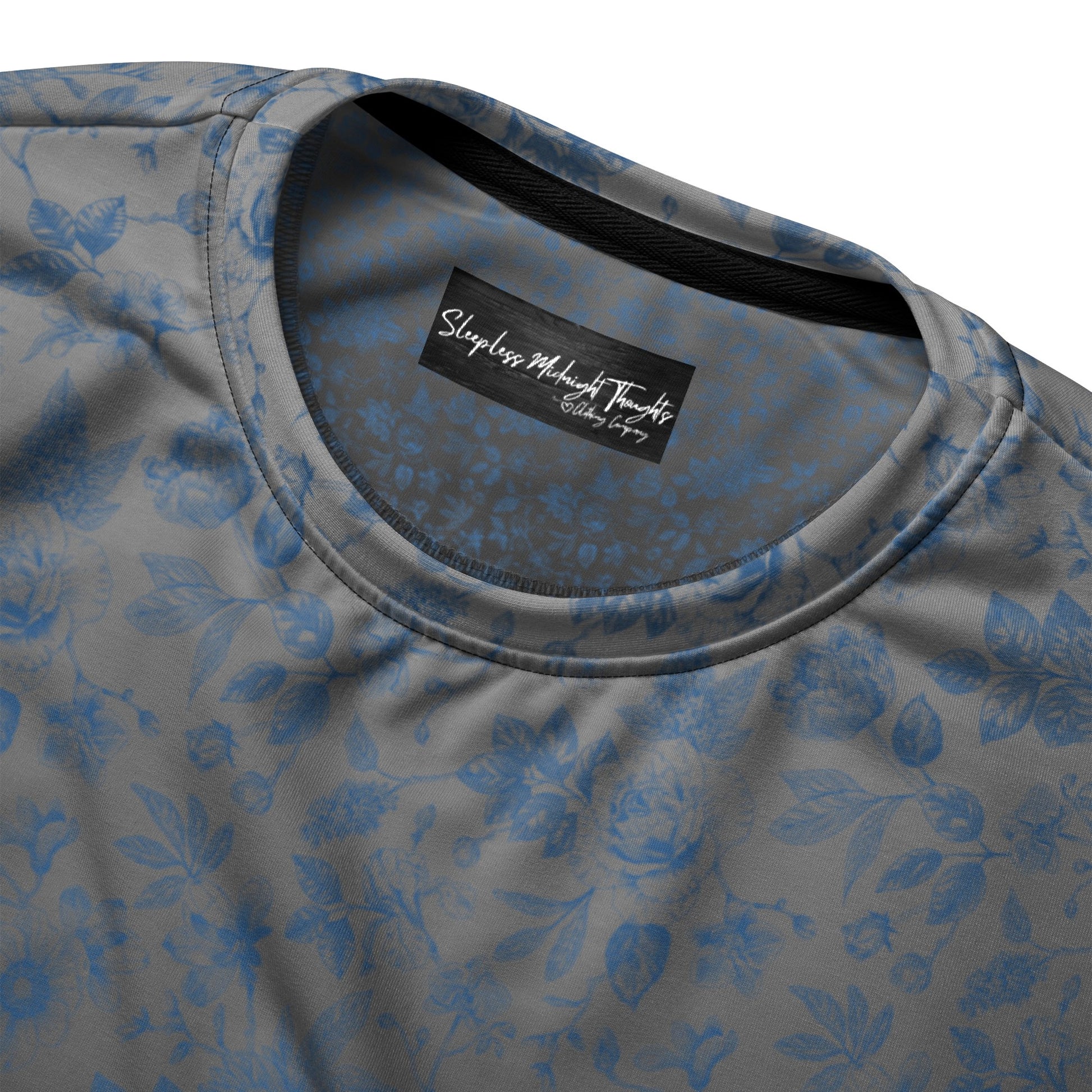 This custom women's all over print sweater has a silver to black ombre pattern starting at the neckline then fading to black at the bottom. There is a blue floral pattern overlayed on the top, perfect for anyone looking to stand out.