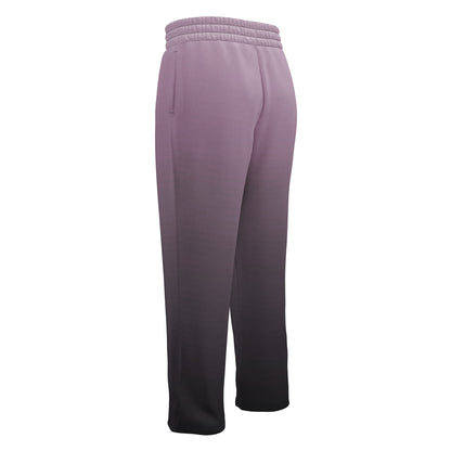 A pair of unisex wide leg joggers that have a ombre pattern starting with a lilac purple at the top then fading to a black at the bottom, the strings are black as well on this pair of pants.
