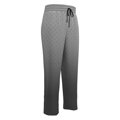A pair of custom wide leg ombre sweatpants starting off as a light grey at the top then fading to a dark slate at the bottom, there is a dark slate grey heart pattern overlayed on the top that fades into the bottom of the sweatpants.