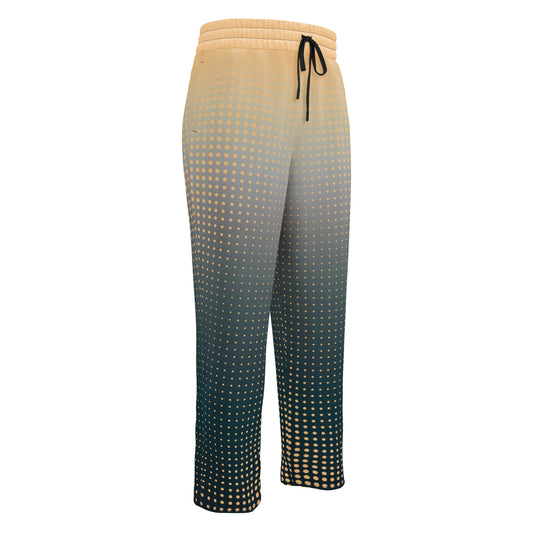 A pair of super soft unisex style wide leg jogger with a ombre pattern that starts as a light orange on the top the fades to a deep teal in the middle of the sweats, there is a polka dot pattern that is light orange throughout the top as well.