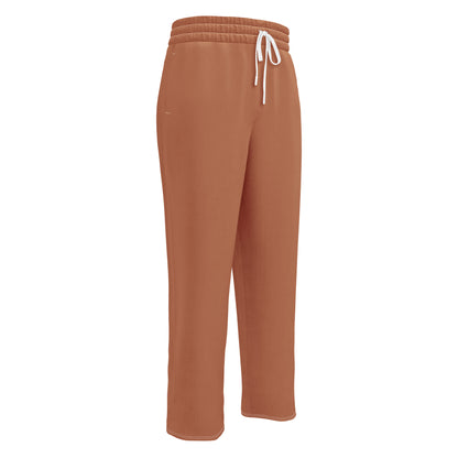 A custom pair of wide leg joggers that are a light caramel brown in color and have white strings around the waistband.