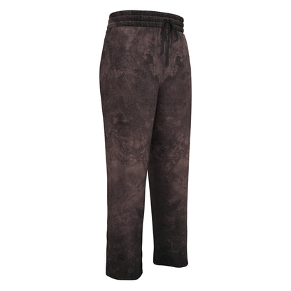 A pair of custom wide leg joggers that have a dark washed brown pattern all over the pants and come with a black string around the waistband.