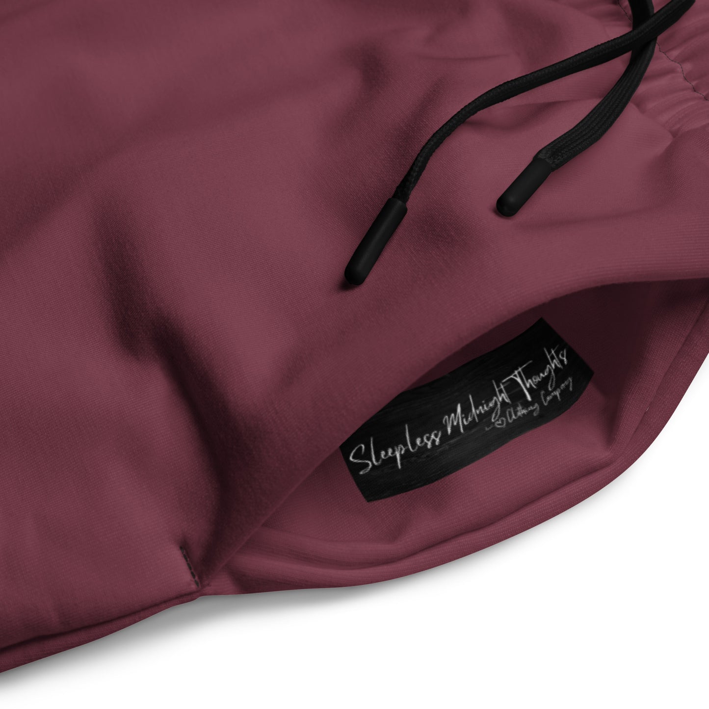 These wide legged joggers are all a deep maroon in color from top to bottom with black strings around the waistband.