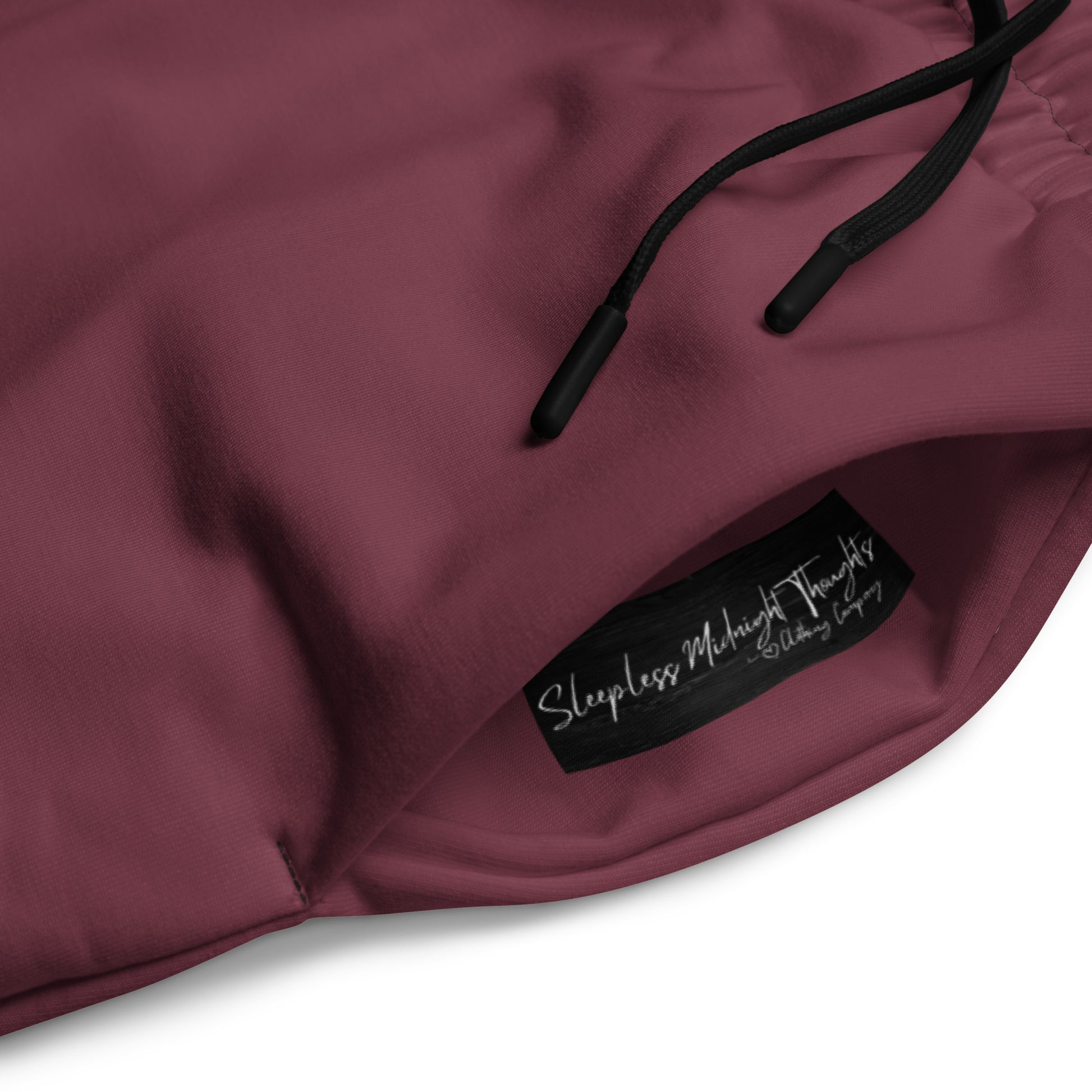 These wide legged joggers are all a deep maroon in color from top to bottom with black strings around the waistband.