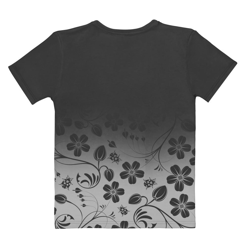 This custom handmade women's short sleeve tee has a ombre design with the top of the shirt being a dark slate grey, then fading to a light grey at the waistline, there is a floral design with flowers and leaves overlayed on the top of the ombre pattern at the bottom that is in the same color of dark slate as on the top.