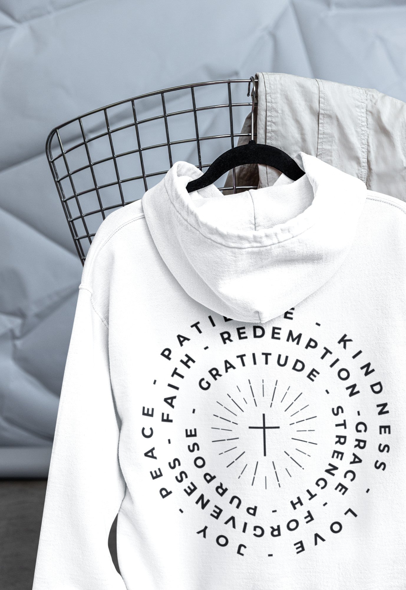 This custom Christian hoodie features a unique design on the back with a centered cross surrounded by circles of words such as Gratitude, Redemption, Patience, Joy, Love, Kindness, Peace, Faith, Forgiveness, Grace, Purpose and Strength.