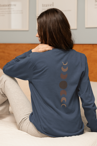 On the back of this custom unisex long sleeve t-shirt from the top of the shirt to the bottom are 7 images of the moon showing the moons cycle, every moon is a different shade of brown.