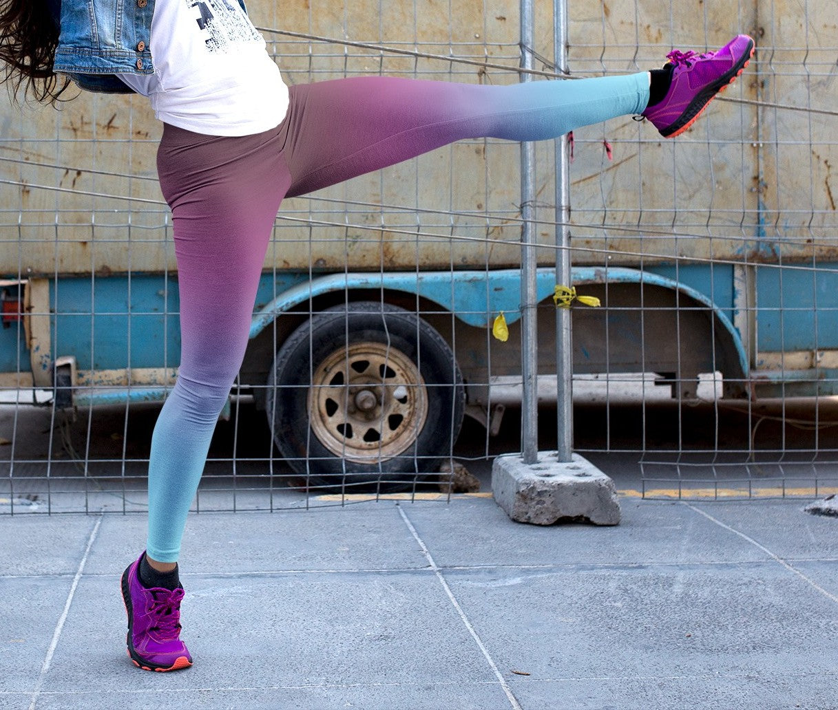 These custom handmade high waisted women's leggings have a ombre pattern with the top of the leggings being a deep purple in color then it fading to a bright turquoise blue at the bottom.