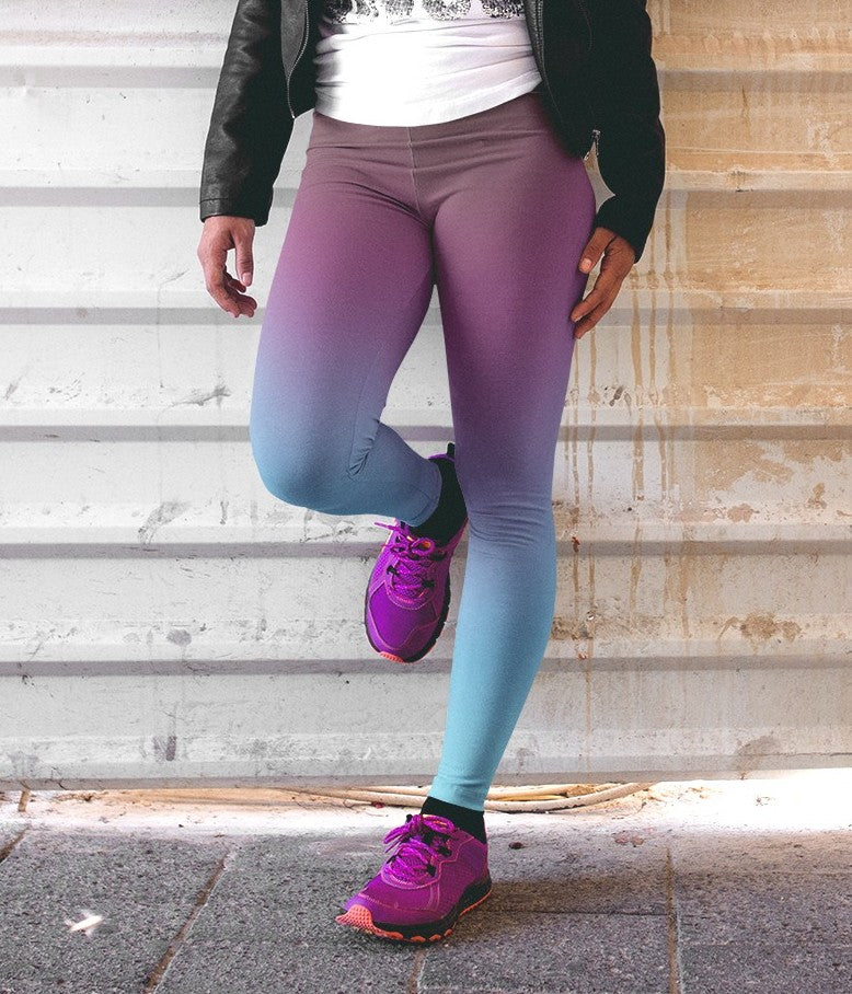 These custom handmade high waisted women's leggings have a ombre pattern with the top of the leggings being a deep purple in color then it fading to a bright turquoise blue at the bottom.