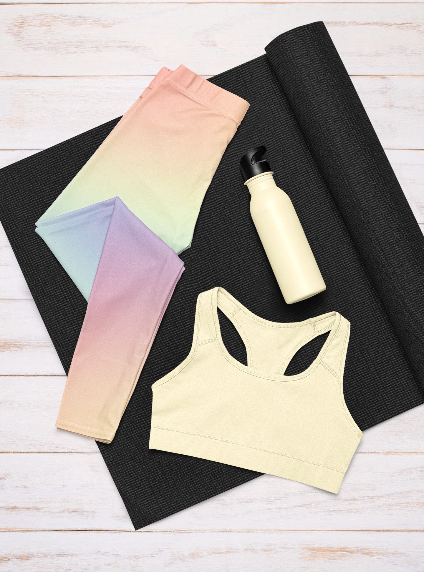 A pair of custom women's high waisted leggings with a soft gradient rainbow pattern all over the pants from top to bottom.