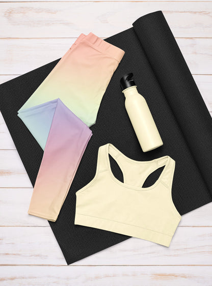 A pair of custom women's high waisted leggings with a soft gradient rainbow pattern all over the pants from top to bottom.