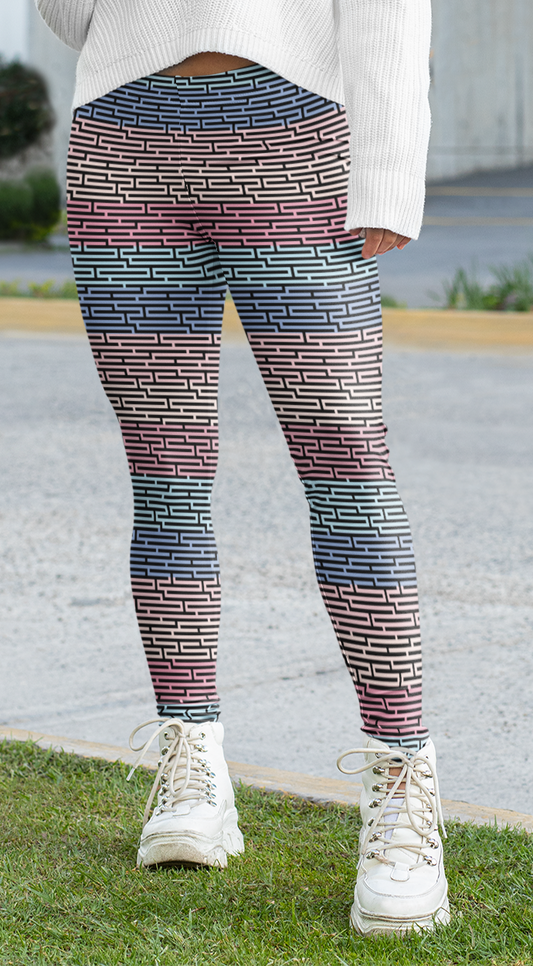 Custom women's high waisted leggings with rows of pastel red, yellow and blue from the top to the bottom of the leggings, there is a black abstract pattern overtop of the colors giving the leggings a 3D look.