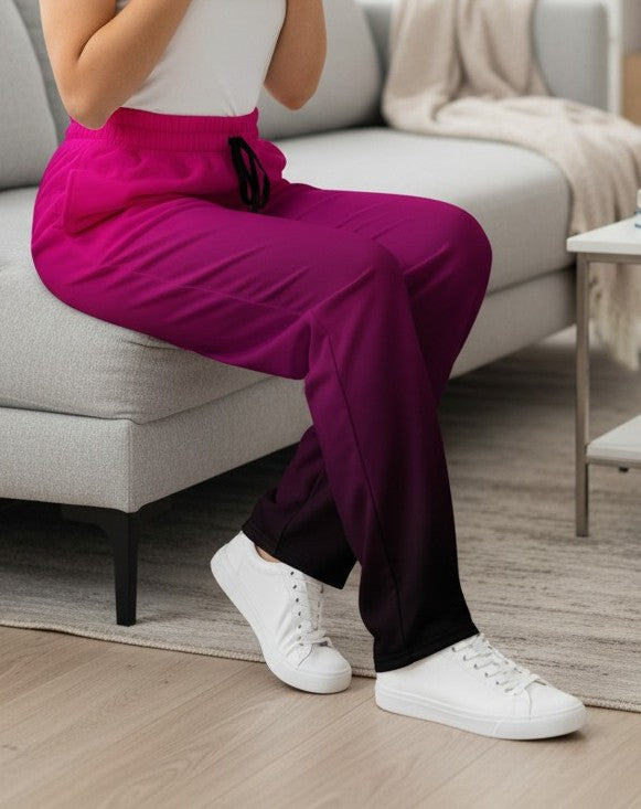 The super soft pair of wide leg joggers start as a bright pink color on the top of the pant then fade to a black at the bottom of the sweats giving the pants a beautiful ombre design.