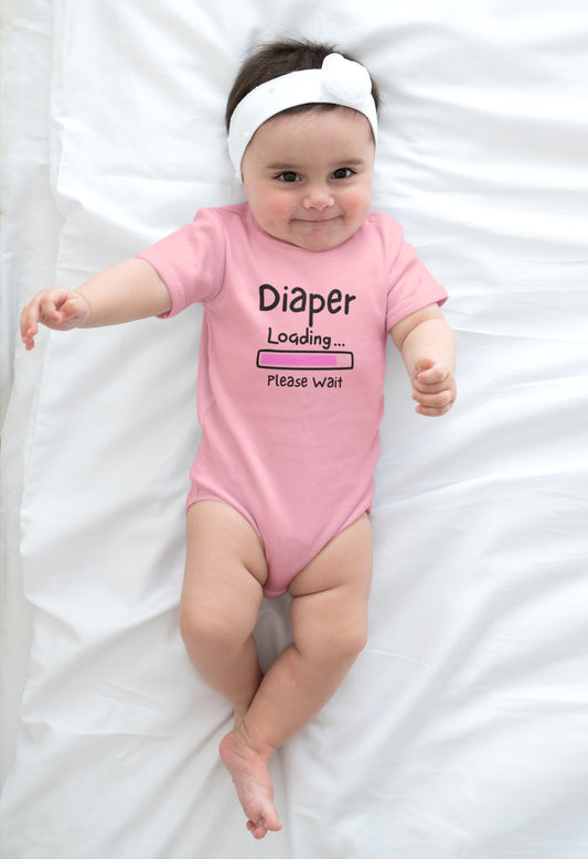 On the front of this custom infant onesie are the words Diaper loading please wait with an image of a battery life bar in pink.