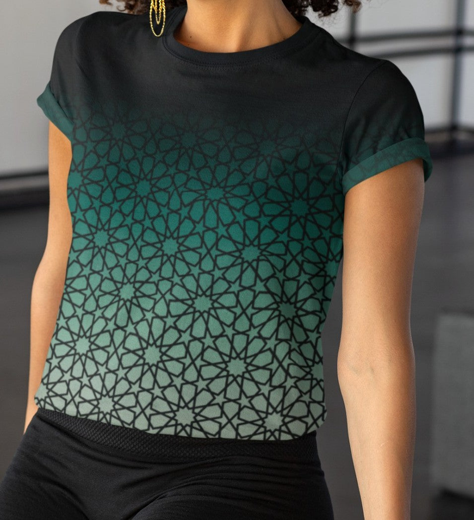 This super soft custom handmade women's tee has a unique and custom ombre floral design, with the top of the shirt being a dark jade green then it fades to a light green at the bottom, there is a dark jade green floral pattern overlayed across the entire shirt.