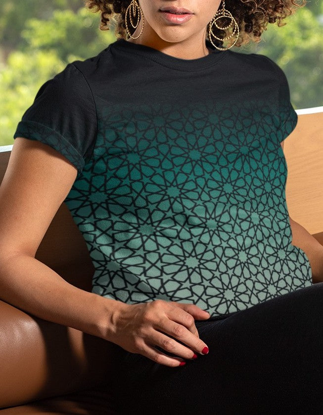 This super soft custom handmade women's tee has a unique and custom ombre floral design, with the top of the shirt being a dark jade green then it fades to a light green at the bottom, there is a dark jade green floral pattern overlayed across the entire shirt.