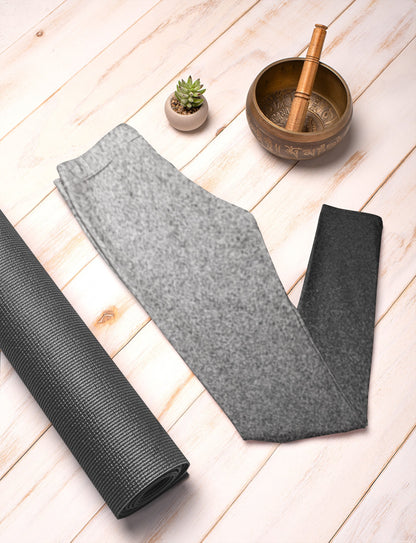 the women's high waisted custom leggings has a ombre static pattern with the top of the pants being a light grey with black static going through it to the bottom of the leggings being black and grey static going through it.