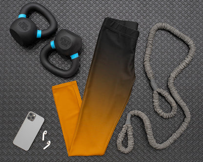 These high waisted super soft handmade women's leggings have a ombre pattern starting with black at the top waistline then fading to a deep burnt orange at the bottom.