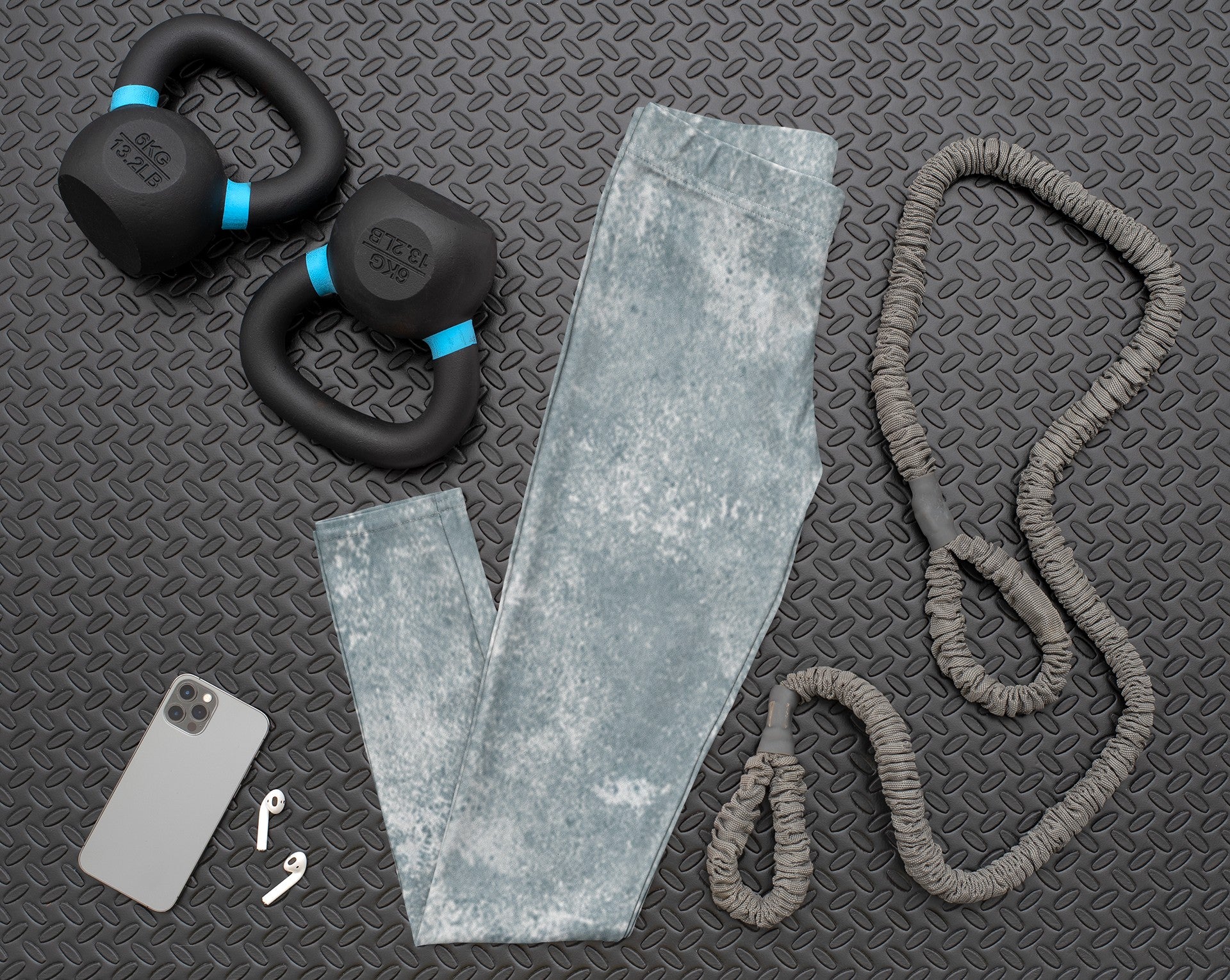 A pair of women's custom high waisted leggings, they have a washed grey pattern all over the pants.