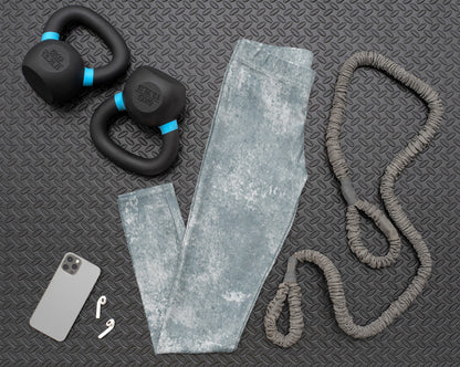 A pair of women's custom high waisted leggings, they have a washed grey pattern all over the pants.