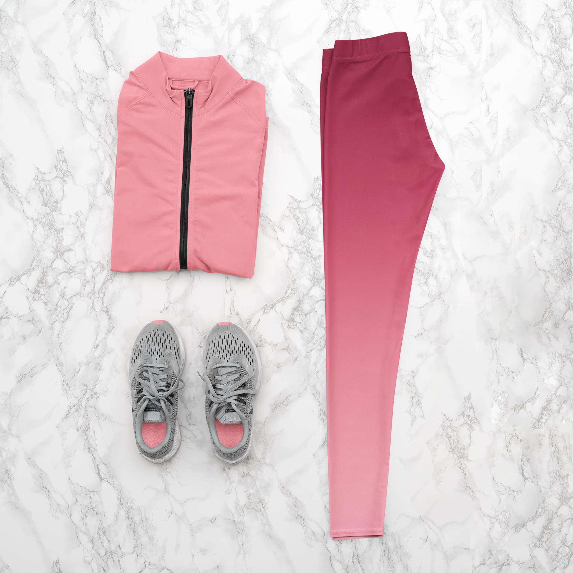 These custom handmade women's high waisted leggings have a pink ombre design with the top of the pants being a dark pink then it fading to a light baby pink at the ankles of the pants.