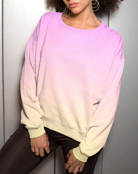 This custom women's sweater has a bright ombre pattern with the top of the pullover being a baby pink color then the sweater fading to a bright yellow color at the bottom.