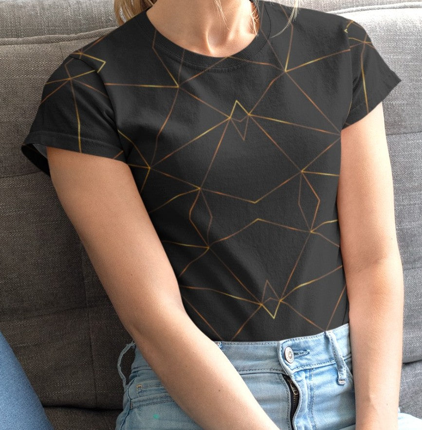 This custom designed handmade women's t-shirt is all black with gold lines that are throughout the shirt in a geometric pattern, the lines are different shades of gold making it look like it is glowing.