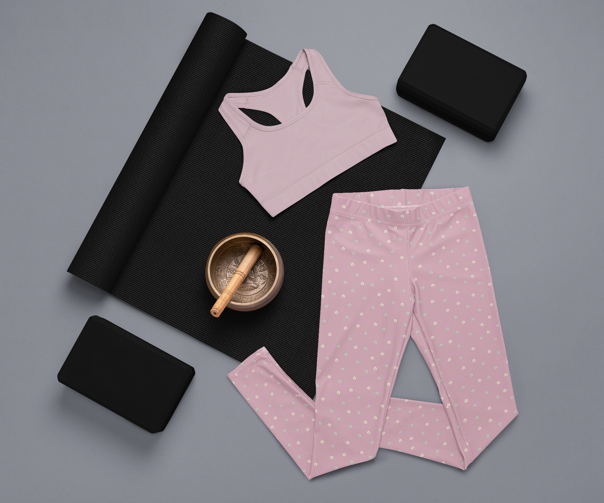 These women's leggings are a dusty rose color with there being little beige flowers all over the entire pair of leggings.