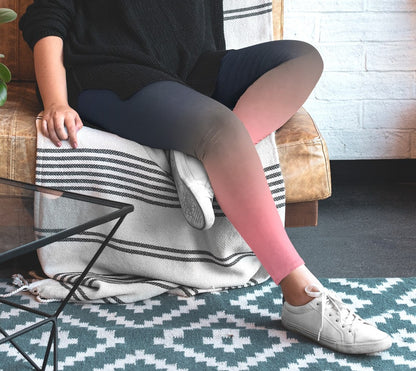 A pair of custom handmade high waisted women's leggings that have a ombre pattern that starts as navy blue at the top waistline of the leggings then fades to a light bubble gum pink at the ankles of the pants.