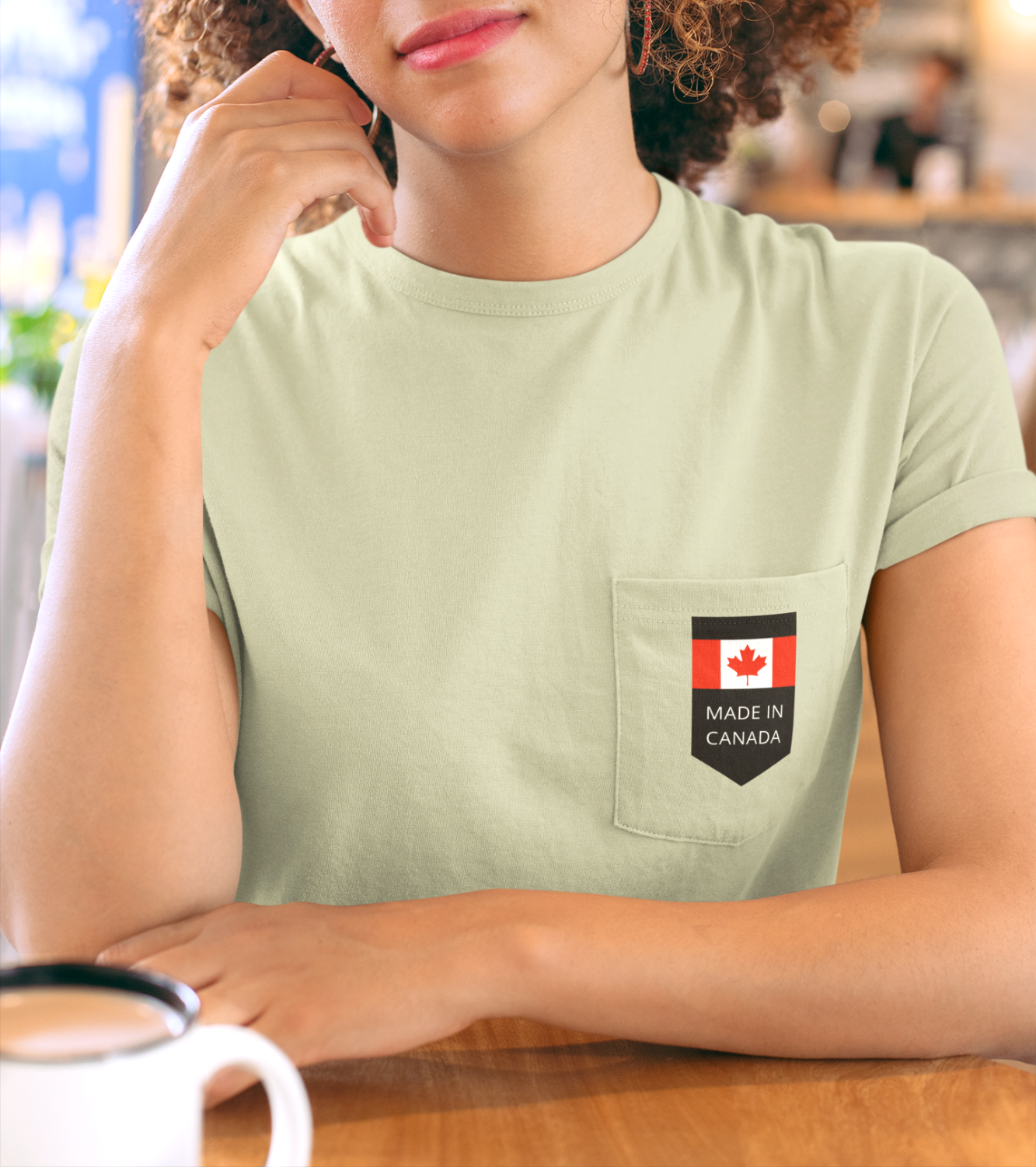 On the front pocket of this custom shirt is a Canadian flag with the words Made in Canada underneath the flag.