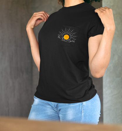 A custom Christian unisex pocket t-shirt, on the pocket that is over the left chest of the shirt is a large sun with the words Be The Light Matthew 5:14 of the Bible.