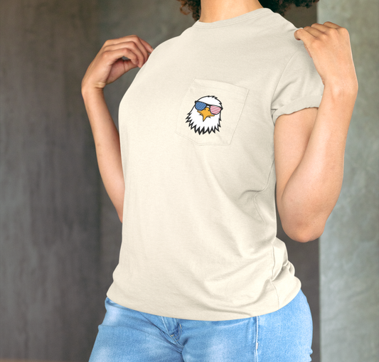 On the front of this custom t-shirt is a image of a bald eagle wearing a pair of sunglasses that have the American flag in the lenses.